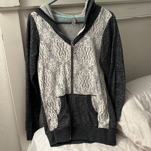 Vanity brand size large. Dark grey zip up jacket with cream color lace front.